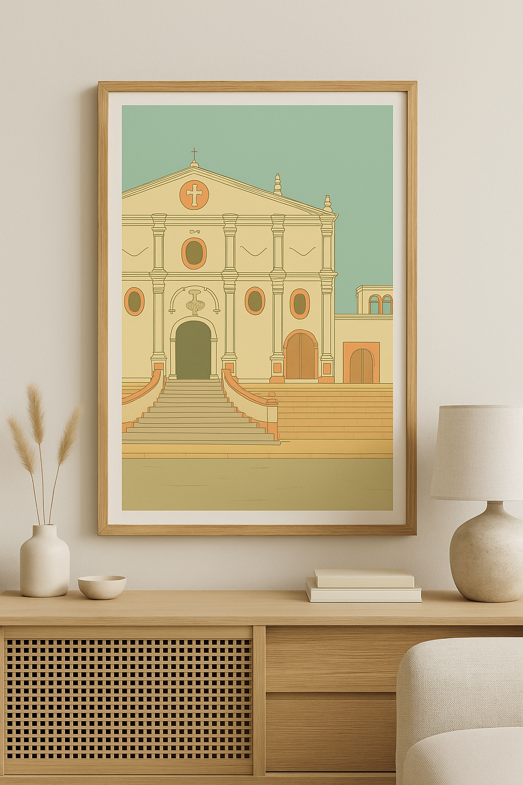 Minimalist framed illustration of a colonial-style church in warm tones, displayed on a wooden console table in a cozy, neutral-toned living space